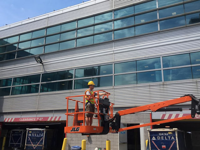 Leak Stoppers roof expert repairing commercial roof.